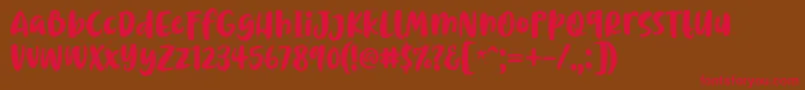 フォントChrisye Font by 7NTypes – 赤い文字が茶色の背景にあります。