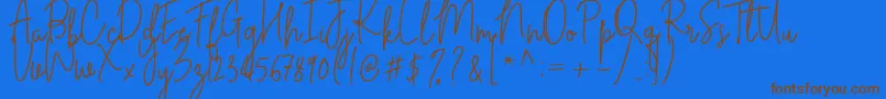 フォントCilupba – 茶色の文字が青い背景にあります。