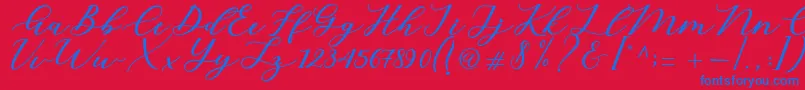 Cintya Script-Schriftart – Blaue Schriften auf rotem Hintergrund