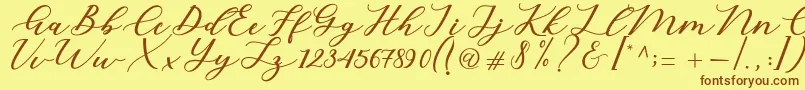 Cintya Script-fontti – ruskeat fontit keltaisella taustalla