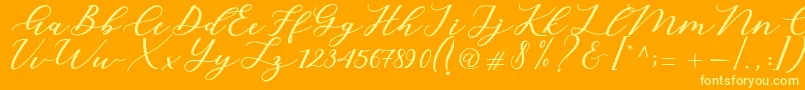 Cintya Script-fontti – keltaiset fontit oranssilla taustalla