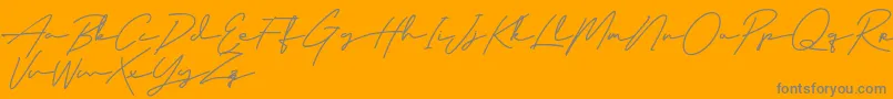 ClassyBeautiful-Schriftart – Graue Schriften auf orangefarbenem Hintergrund