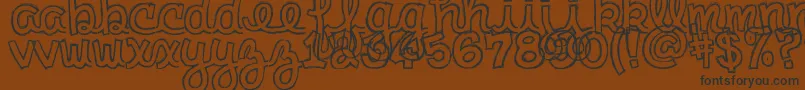 clementine sketch-Schriftart – Schwarze Schriften auf braunem Hintergrund