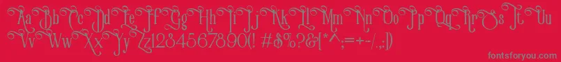 VictorianParlorVintageAlternateFree-fontti – harmaat kirjasimet punaisella taustalla
