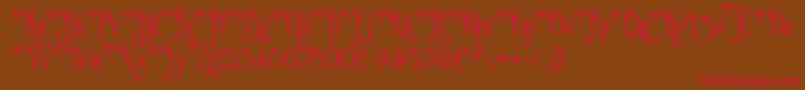 フォントVictorianParlorVintageAlternateFree – 赤い文字が茶色の背景にあります。