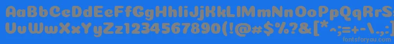 Coiny Cyrillic-Schriftart – Graue Schriften auf blauem Hintergrund