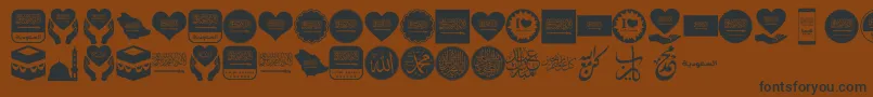 Color Saudi Arabia-fontti – mustat fontit ruskealla taustalla