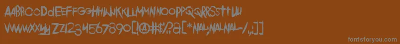 フォントComeback Of The Damned – 茶色の背景に灰色の文字