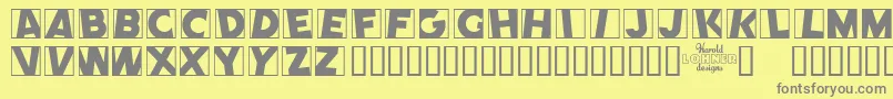 COMEP   -Schriftart – Graue Schriften auf gelbem Hintergrund