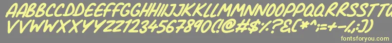 Comic Marker Deluxe Italic-fontti – keltaiset fontit harmaalla taustalla