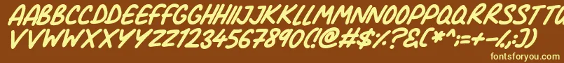 Comic Marker Deluxe Italic-fontti – keltaiset fontit ruskealla taustalla