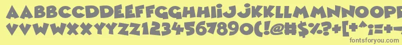 フォントComic Queens – 黄色の背景に灰色の文字