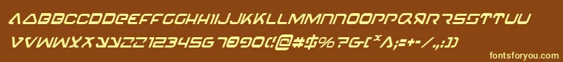 4114BlasterCondensedItalic-fontti – keltaiset fontit ruskealla taustalla