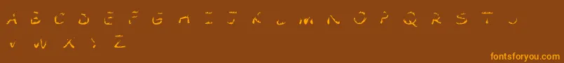 フォントComic Tragedy Flames   BC – オレンジ色の文字が茶色の背景にあります。