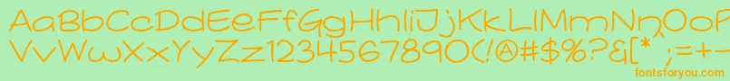 Comicblast Regular-fontti – oranssit fontit vihreällä taustalla