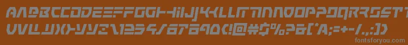 commandoverrideital-fontti – harmaat kirjasimet ruskealla taustalla