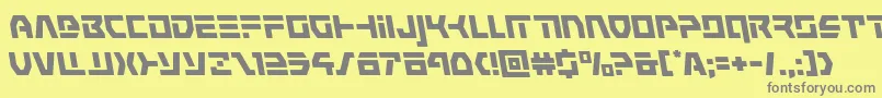 commandoverrideleft-fontti – harmaat kirjasimet keltaisella taustalla
