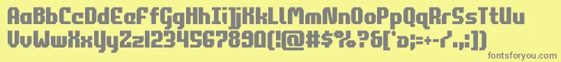 commonwealthcond-fontti – harmaat kirjasimet keltaisella taustalla