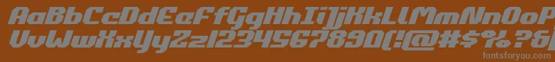 commonwealthexpandital-fontti – harmaat kirjasimet ruskealla taustalla