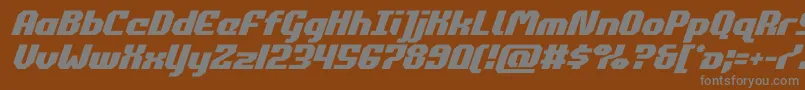 commonwealthital-fontti – harmaat kirjasimet ruskealla taustalla