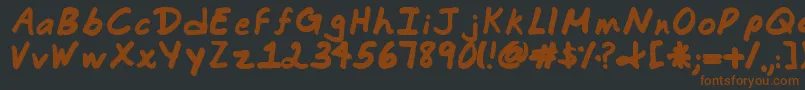 Commotion Business Font – Brown Fonts on Black Background