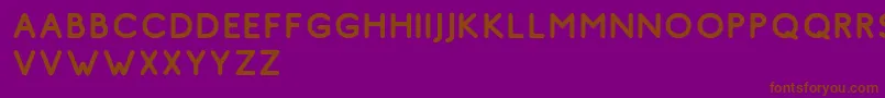 フォントComodo Regular Free – 紫色の背景に茶色のフォント