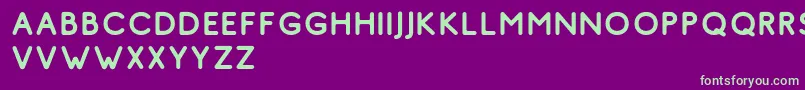 フォントComodo Regular Free – 紫の背景に緑のフォント