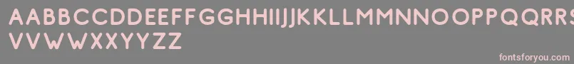 フォントComodo Regular Free – 灰色の背景にピンクのフォント