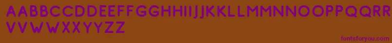 Шрифт Comodo Vintage Free – фиолетовые шрифты на коричневом фоне