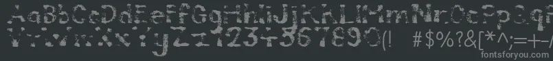 Compostable-fontti – harmaat kirjasimet mustalla taustalla