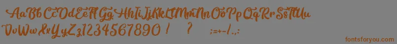 フォントContemplation – 茶色の文字が灰色の背景にあります。