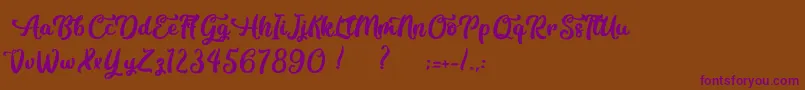 Czcionka Contemplation – fioletowe czcionki na brązowym tle