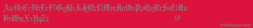cooed   -Schriftart – Graue Schriften auf rotem Hintergrund