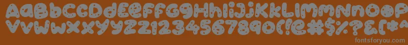 Cookies-Schriftart – Graue Schriften auf braunem Hintergrund