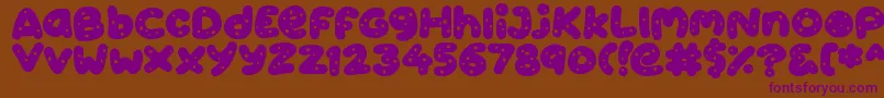 Cookies Font – Purple Fonts on Brown Background