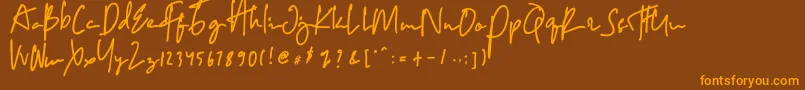 フォントCopalanga – オレンジ色の文字が茶色の背景にあります。