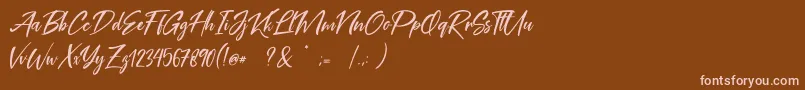 フォントCoral Pen Free – 茶色の背景にピンクのフォント