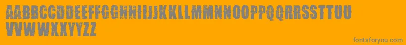 VtksDesgaste-Schriftart – Graue Schriften auf orangefarbenem Hintergrund