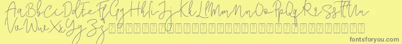 Corline Signature-fontti – harmaat kirjasimet keltaisella taustalla