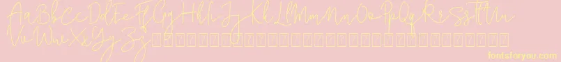 フォントCorline Signature – 黄色のフォント、ピンクの背景