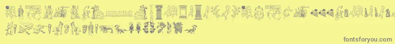 Cornucopia of Dingbats Two-fontti – harmaat kirjasimet keltaisella taustalla