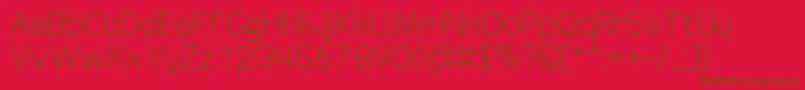 DrakoheartRevofitOriginal-Schriftart – Braune Schriften auf rotem Hintergrund
