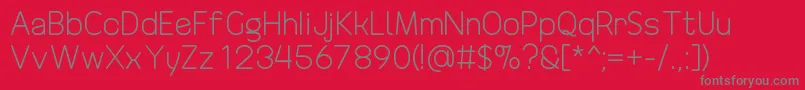 DrakoheartRevofitOriginal Font – Gray Fonts on Red Background