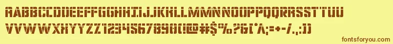 フォントcovertopslaser – 茶色の文字が黄色の背景にあります。