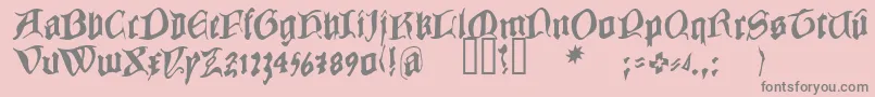 COWBC   -fontti – harmaat kirjasimet vaaleanpunaisella taustalla