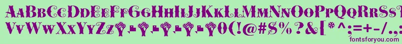 Czcionka Cowboya Bifurcated – fioletowe czcionki na zielonym tle