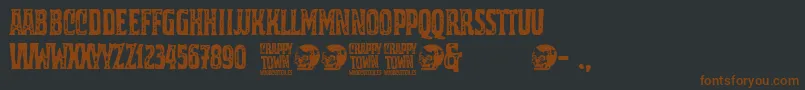 フォントCrappy Town – 黒い背景に茶色のフォント