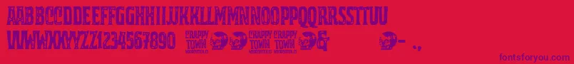 Crappy Town-Schriftart – Violette Schriften auf rotem Hintergrund