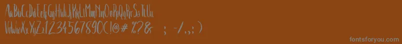 フォントCrash Two – 茶色の背景に灰色の文字