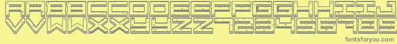 Crazy COokies-fontti – harmaat kirjasimet keltaisella taustalla